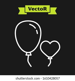 White line Balloons in form of heart with ribbon icon isolated on black background.  Vector Illustration