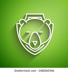 White line Bear head on shield icon isolated on green background. Hunting trophy on wall.  Vector Illustration