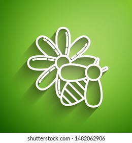 White line Bee and flower icon isolated on green background. Sweet natural food. Honeybee or apis with wings symbol. Flying insect.  Vector Illustration