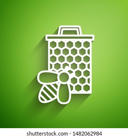 White line Bee and honeycomb icon isolated on green background. Honey cells. Sweet natural food. Honeybee or apis with wings symbol. Flying insect.  Vector Illustration