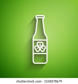 White line Beer bottle with four leaf clover icon isolated on green background. Happy Saint Patricks day.  Vector Illustration