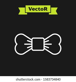 White line Bow tie icon isolated on black background.  Vector Illustration