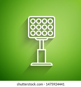 White line Bright stadium lights icon isolated on green background. Spotlight on a football field. Floodlight, light projector.  Vector Illustration