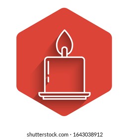 White line Burning candle in candlestick icon isolated with long shadow. Cylindrical candle stick with burning flame. Red hexagon button. Vector Illustration