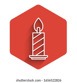 White line Burning candle in candlestick icon isolated with long shadow. Cylindrical candle stick with burning flame. Red hexagon button. Vector Illustration