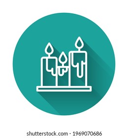 White line Burning candles icon isolated with long shadow. Cylindrical candle stick with burning flame. Green circle button. Vector Illustration