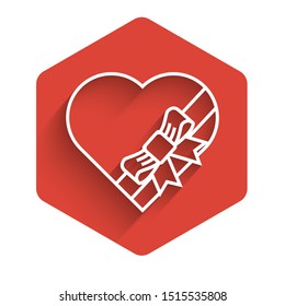 White line Candy in heart shaped box and bow icon isolated with long shadow. Valentines Day. Red hexagon button. Vector Illustration