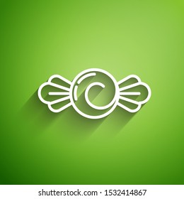 White line Candy icon isolated on green background. Happy Halloween party.  Vector Illustration