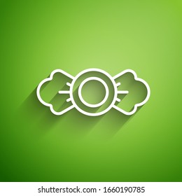 White line Candy icon isolated on green background.  Vector Illustration