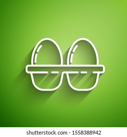 White line Chicken egg in box icon isolated on green background.  Vector Illustration