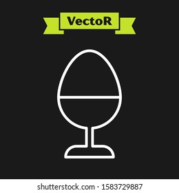 White line Chicken egg on a stand icon isolated on black background.  Vector Illustration