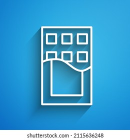 White line Chocolate bar icon isolated on blue background. Long shadow. Vector