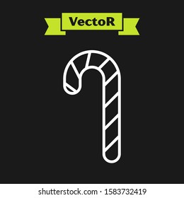 White line Christmas candy cane with stripes icon isolated on black background. Merry Christmas and Happy New Year.  Vector Illustration