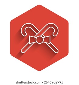 White line Christmas candy cane with stripes icon isolated with long shadow. Merry Christmas and Happy New Year. Red hexagon button. Vector