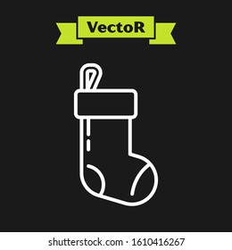 White line Christmas stocking icon isolated on black background. Merry Christmas and Happy New Year.  Vector Illustration