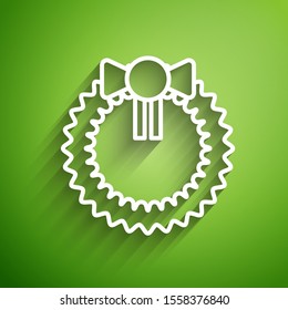 White line Christmas wreath icon isolated on green background. Merry Christmas and Happy New Year.  Vector Illustration