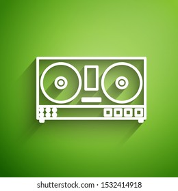 White line DJ remote for playing and mixing music icon isolated on green background. DJ mixer complete with vinyl player and remote control.  Vector Illustration