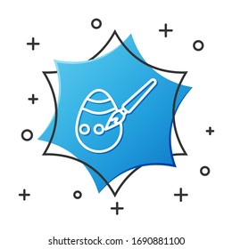 White line Easter egg and paint brush icon isolated on white background. Happy Easter. Blue hexagon button. Vector Illustration