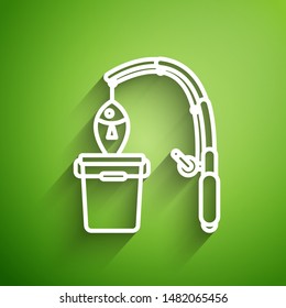 White line Fishing rod and fish icon isolated on green background. Put fish into a bucket. Fishing equipment and fish farming topics.  Vector Illustrationn