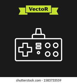 White line Gamepad icon isolated on black background. Game controller.  Vector Illustration