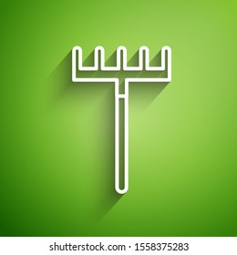 White line Garden rake icon isolated on green background. Tool for horticulture, agriculture, farming. Ground cultivator. Housekeeping equipment.  Vector Illustration