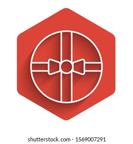 White line Gift box icon isolated with long shadow. Merry Christmas and Happy New Year. Red hexagon button. Vector Illustration