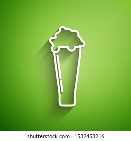 White line Glass of beer icon isolated on green background.  Vector Illustration