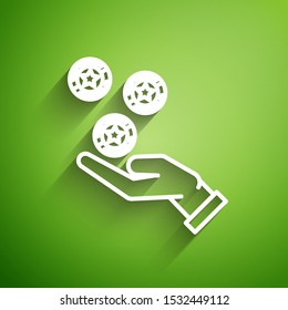 White line Hand holding casino chips icon isolated on green background. Casino gambling.  Vector Illustration
