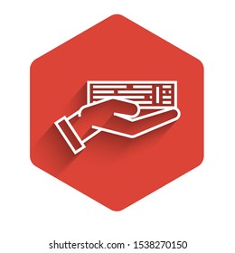 White line Hand holding deck of playing cards icon isolated with long shadow. Casino gambling. Red hexagon button. Vector Illustration