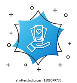 White line Hand holding playing cards icon isolated on white background. Casino game design. Blue hexagon button. Vector Illustration