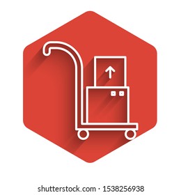 White line Hand truck and boxes icon isolated with long shadow. Dolly symbol. Red hexagon button. Vector Illustration