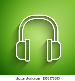 White line Headphones icon isolated on green background. Earphones sign. Concept for listening to music, service, communication and operator.  Vector Illustration
