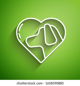 White line Heart with dog icon isolated on green background. Pet paw in heart. Love to the animals.  Vector Illustration