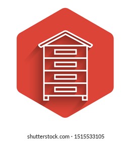 White line Hive for bees icon isolated with long shadow. Beehive symbol. Apiary and beekeeping. Sweet natural food. Red hexagon button. Vector Illustration