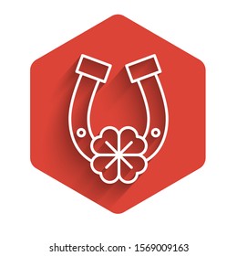 White line Horseshoe with four leaf clover icon isolated with long shadow. Happy Saint Patricks day. Red hexagon button. Vector Illustration