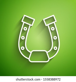 White line Horseshoe icon isolated on green background.  Vector Illustration