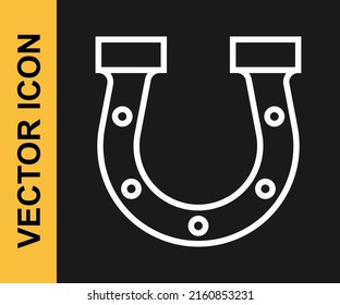 White line Horseshoe icon isolated on black background.  Vector
