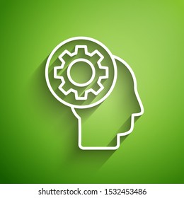 White line Human head with gear inside icon isolated on green background. Artificial intelligence. Thinking brain sign. Symbol work of brain.  Vector Illustration