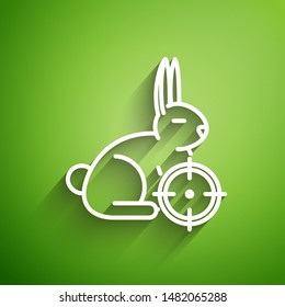 White line Hunt on rabbit with crosshairs icon isolated on green background. Hunting club logo with rabbit and target. Rifle lens aiming a hare.  Vector Illustration