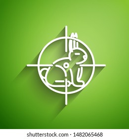 White line Hunt on rabbit with crosshairs icon isolated on green background. Hunting club logo with rabbit and target. Rifle lens aiming a hare.  Vector Illustration