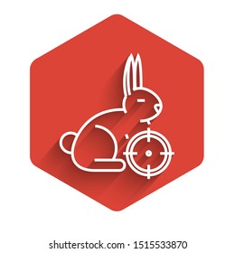 White line Hunt on rabbit with crosshairs icon isolated with long shadow. Hunting club logo with rabbit and target. Rifle lens aiming a hare. Red hexagon button. Vector Illustration