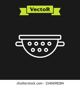 White line Kitchen colander icon isolated on black background. Cooking utensil. Cutlery sign.  Vector Illustration