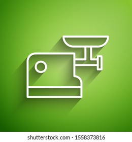 White line Kitchen meat grinder icon isolated on green background.  Vector Illustration