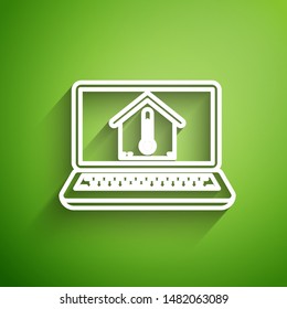 White line Laptop with house temperature icon isolated on green background. Thermometer icon.  Vector Illustration