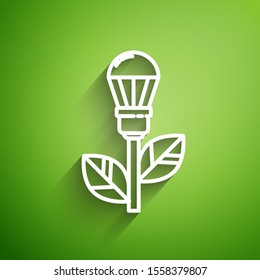 White line Light bulb with leaf icon isolated on green background. Eco energy concept. Alternative energy concept.  Vector Illustration