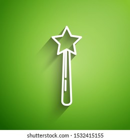 White line Magic wand icon isolated on green background. Star shape magic accessory. Magical power.  Vector Illustration