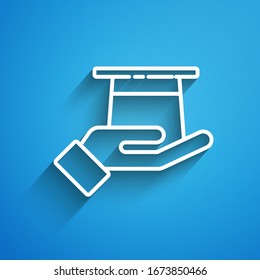 White line Magician hat in hand icon isolated on blue background. Magic trick. Mystery entertainment concept. Long shadow. Vector Illustration