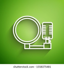 White line Microphone icon isolated on green background. On air radio mic microphone. Speaker sign.  Vector Illustration