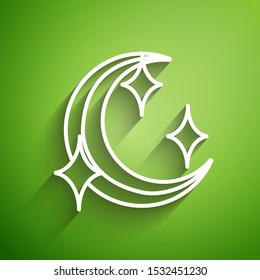 White line Moon and stars icon isolated on green background.  Vector Illustration