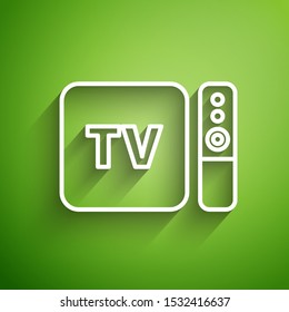 White line Multimedia and TV box receiver and player with remote controller icon isolated on green background.  Vector Illustration
